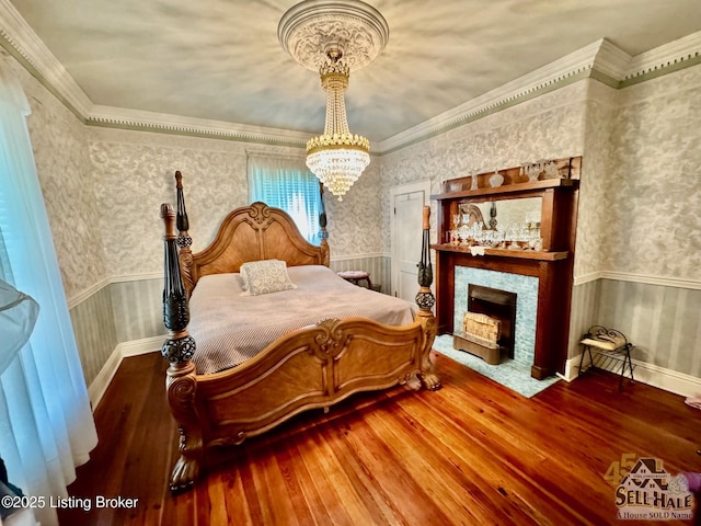 116 Lebanon Hl, Springfield, KY 40069 - bedroom with wood-type flooring, wainscoting, and a chandelier