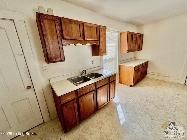 116 Lebanon Hl, Springfield, KY 40069 - kitchen featuring a sink, light countertops, and brown cabinets