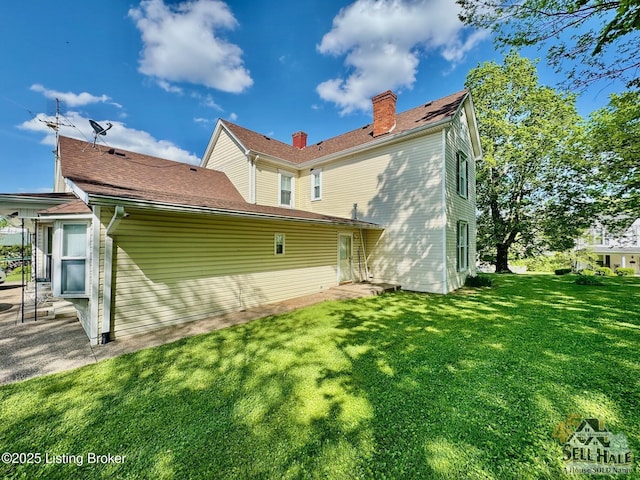 116 Lebanon Hl, Springfield, KY 40069 - rear view of property featuring a lawn, a chimney, and entry steps