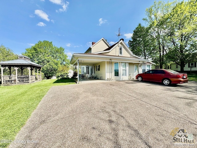 116 Lebanon Hl, Springfield, KY 40069 - view of front facade with covered porch, a front yard, a chimney, concrete driveway, and a gazebo