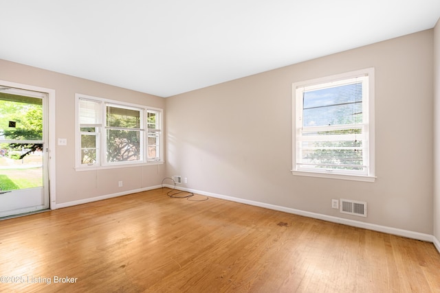 4605 S 3rd St, Louisville, KY 40214 - unfurnished room featuring baseboards, visible vents, and light wood-style floors