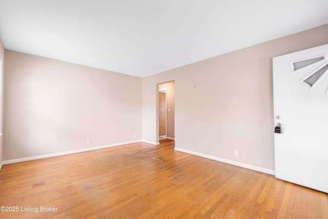 4605 S 3rd St, Louisville, KY 40214 - spare room with baseboards and light wood finished floors