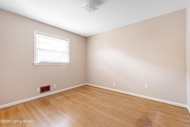 4605 S 3rd St, Louisville, KY 40214 - unfurnished room featuring baseboards, light wood finished floors, and visible vents