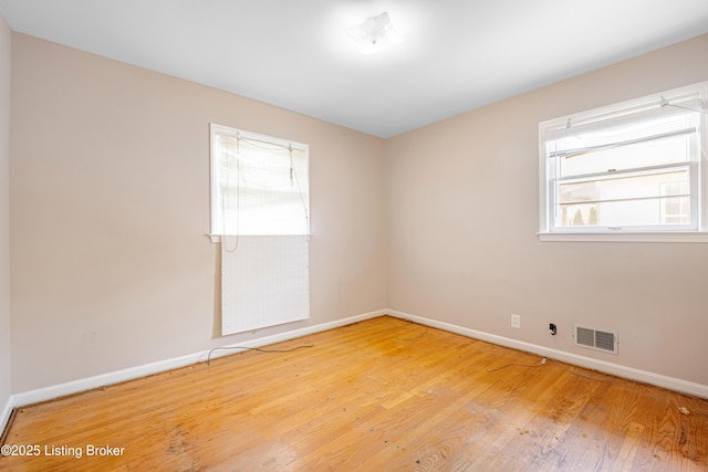 4605 S 3rd St, Louisville, KY 40214 - spare room with baseboards, wood finished floors, and visible vents
