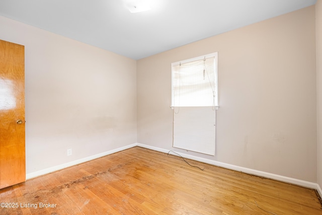 4605 S 3rd St, Louisville, KY 40214 - spare room featuring baseboards and wood finished floors
