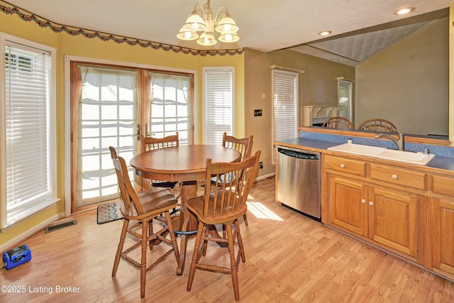 dining area featuring visible vents, baseboards, light wood finished floors, a chandelier, and recessed lighting