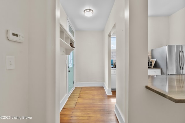 612 E Ormsby Ave, Louisville, KY 40203 - corridor with light wood-style floors, plenty of natural light, and baseboards