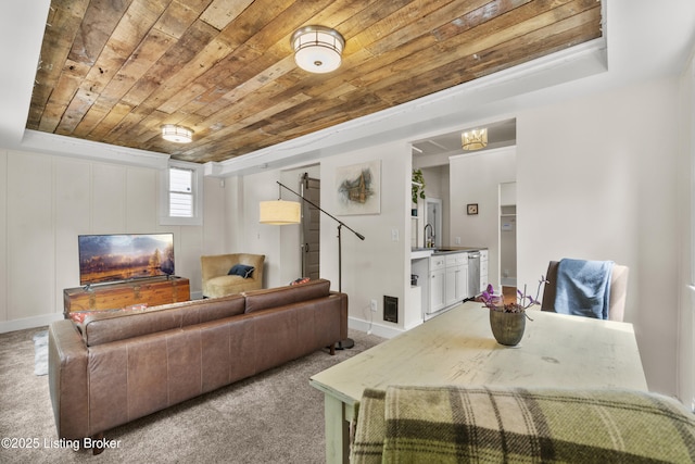 612 E Ormsby Ave, Louisville, KY 40203 - living area with wooden ceiling, carpet floors, and baseboards