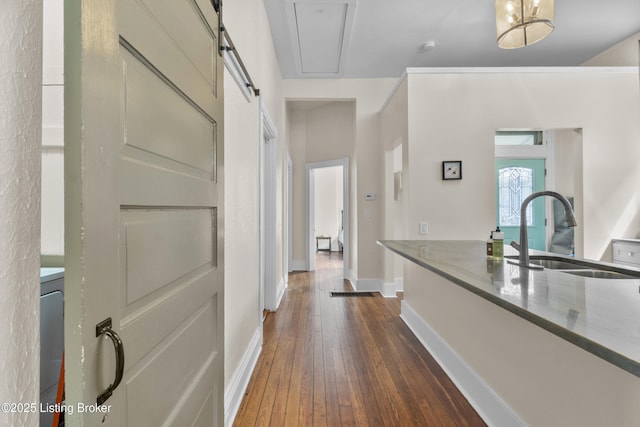 612 E Ormsby Ave, Louisville, KY 40203 - hall featuring a sink, baseboards, and dark wood finished floors