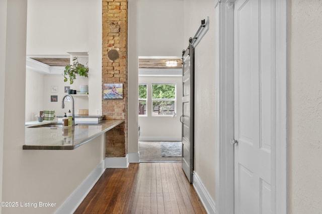 612 E Ormsby Ave, Louisville, KY 40203 - bathroom with a sink, wood-type flooring, and baseboards