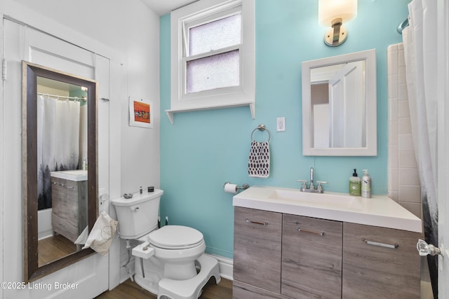 612 E Ormsby Ave, Louisville, KY 40203 - bathroom featuring toilet, vanity, baseboards, and wood finished floors
