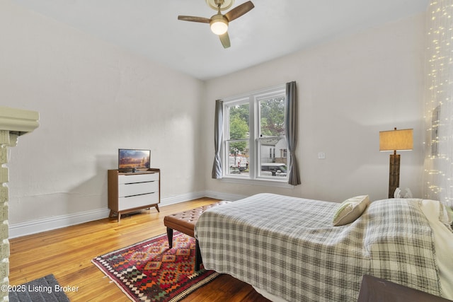 612 E Ormsby Ave, Louisville, KY 40203 - bedroom with wood finished floors, baseboards, and ceiling fan