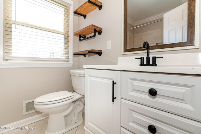 bathroom with tile patterned flooring, vanity, toilet, baseboards, and visible vents