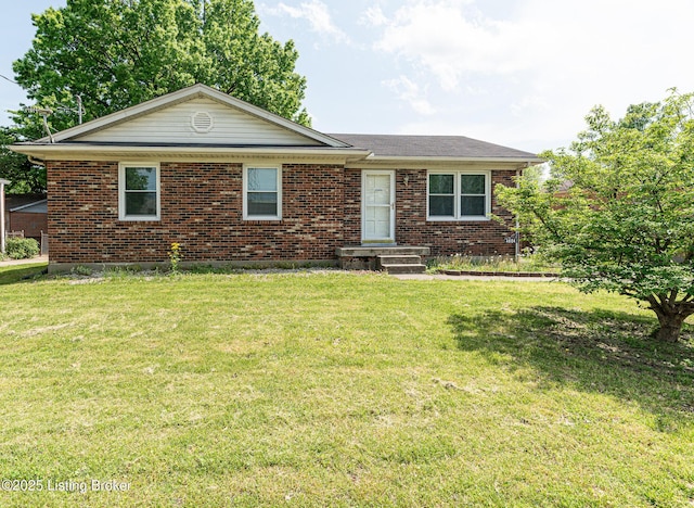 ranch-style house with brick siding and a front yard