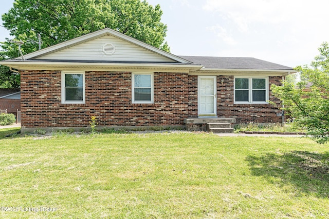 ranch-style house with brick siding and a front yard