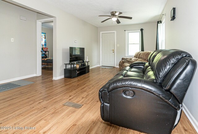 3962 Craig Ave, Louisville, KY 40215 - living area featuring ceiling fan, light wood-type flooring, and baseboards