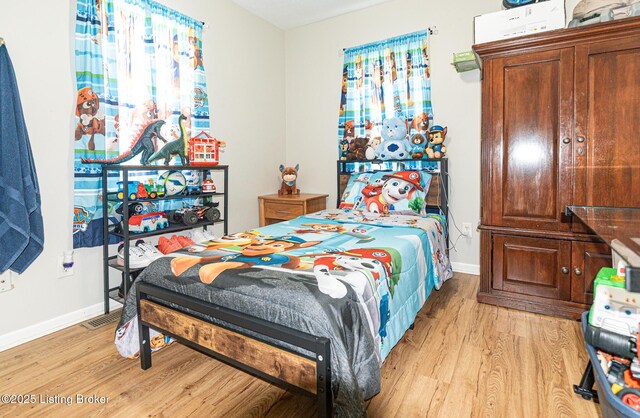 3962 Craig Ave, Louisville, KY 40215 - bedroom featuring light wood-type flooring and baseboards