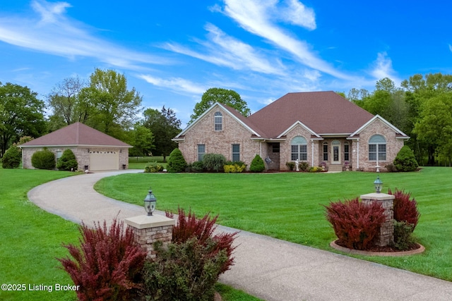 15815 Crystal Valley Way, Louisville, KY 40299 - view of front facade featuring a front lawn, an outdoor structure, brick siding, and driveway
