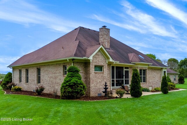 15815 Crystal Valley Way, Louisville, KY 40299 - view of side of property with brick siding, a patio, a lawn, a chimney, and crawl space