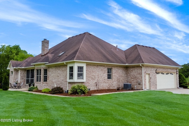 15815 Crystal Valley Way, Louisville, KY 40299 - view of property exterior featuring an attached garage, central air condition unit, concrete driveway, and a yard
