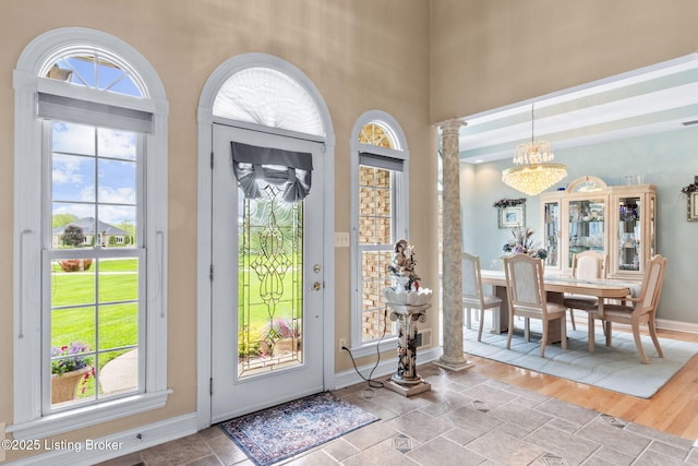15815 Crystal Valley Way, Louisville, KY 40299 - entryway with a chandelier, decorative columns, a high ceiling, and baseboards