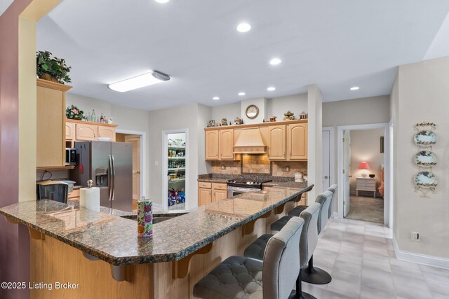 15815 Crystal Valley Way, Louisville, KY 40299 - kitchen with appliances with stainless steel finishes, custom range hood, light brown cabinets, a peninsula, and recessed lighting