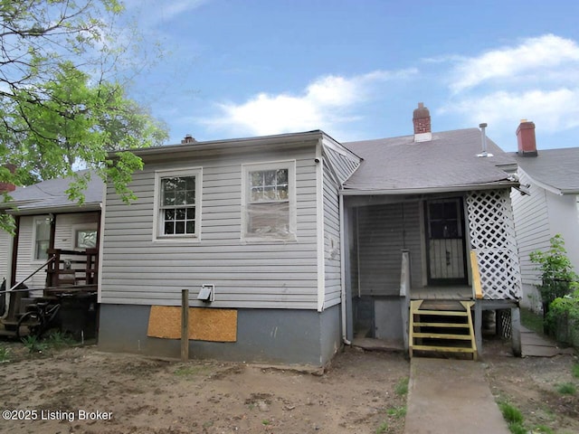 view of front facade featuring a chimney
