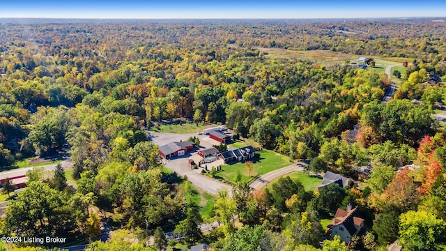 birds eye view of property with a wooded view
