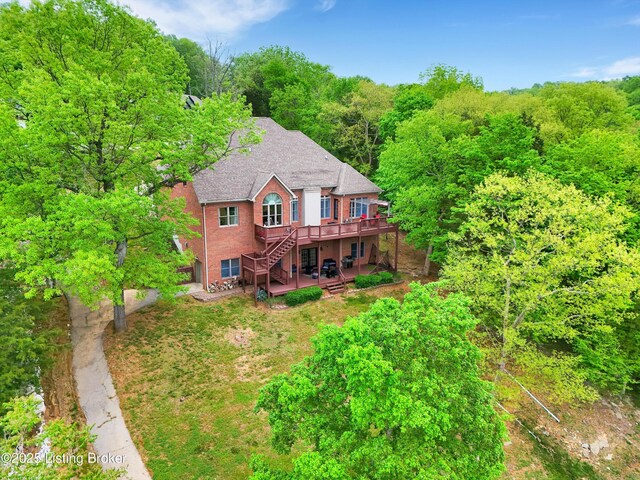302 Hampton Rd, Brandenburg, KY 40108 - back of house featuring stairs, brick siding, a deck, a forest view, and a patio