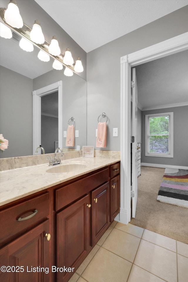 302 Hampton Rd, Brandenburg, KY 40108 - bathroom with crown molding, vanity, baseboards, and tile patterned floors