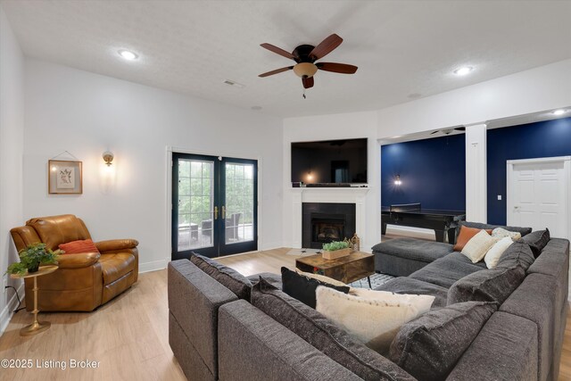 302 Hampton Rd, Brandenburg, KY 40108 - living area featuring a ceiling fan, visible vents, a fireplace, recessed lighting, and light wood-style flooring