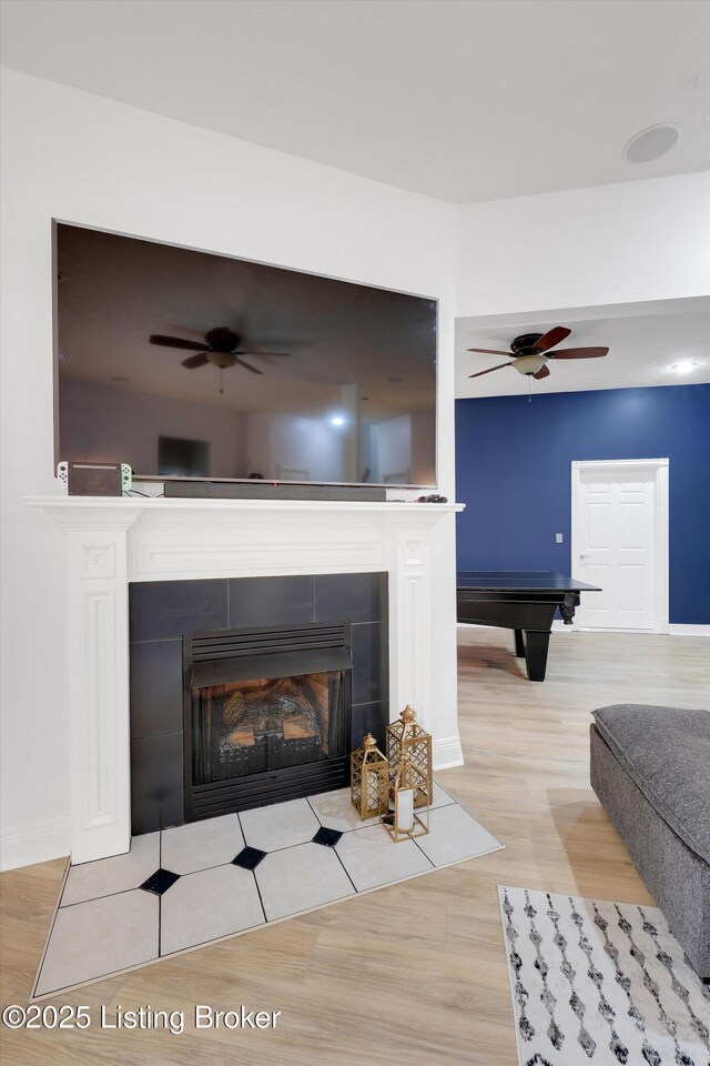 302 Hampton Rd, Brandenburg, KY 40108 - room details with a ceiling fan, pool table, a tile fireplace, wood finished floors, and baseboards