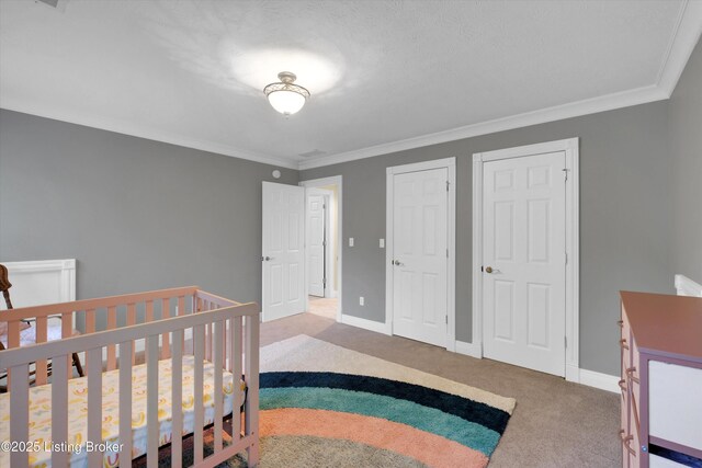 302 Hampton Rd, Brandenburg, KY 40108 - carpeted bedroom with crown molding, baseboards, and multiple closets