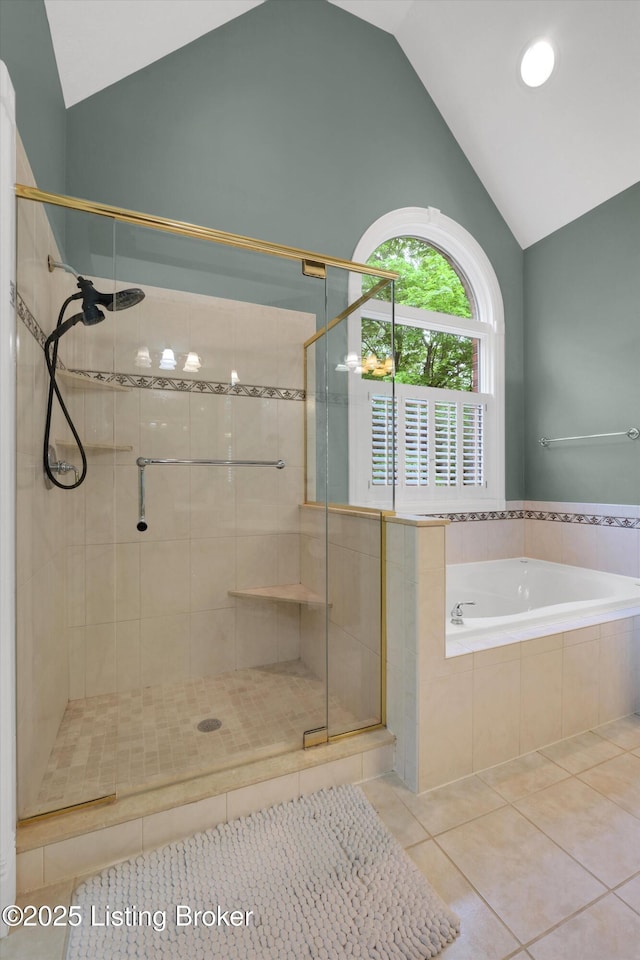 302 Hampton Rd, Brandenburg, KY 40108 - full bathroom with high vaulted ceiling, tile patterned flooring, a stall shower, and a garden tub