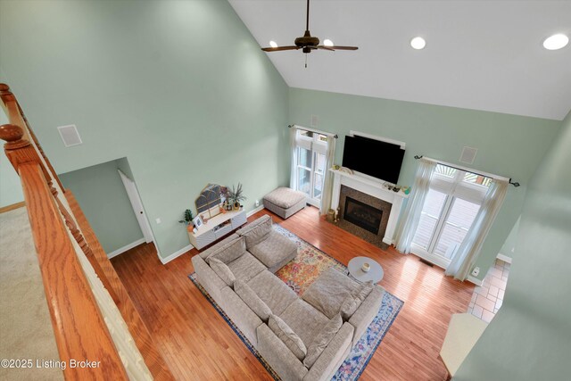 302 Hampton Rd, Brandenburg, KY 40108 - living area with a fireplace with flush hearth, ceiling fan, a healthy amount of sunlight, and high vaulted ceiling