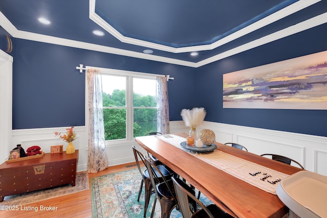302 Hampton Rd, Brandenburg, KY 40108 - dining area featuring crown molding, a tray ceiling, wainscoting, and wood finished floors