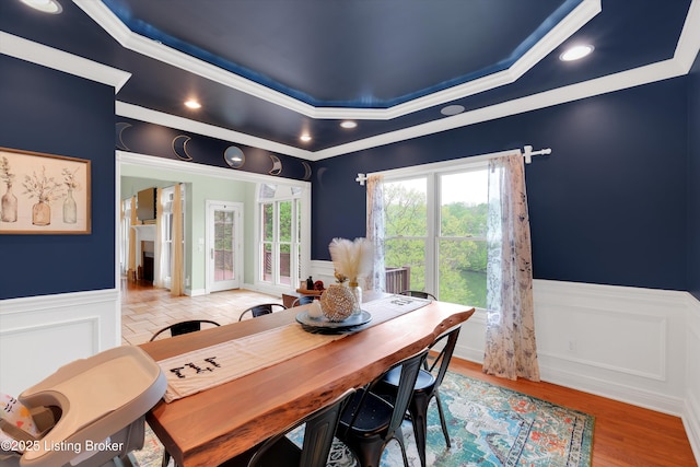 302 Hampton Rd, Brandenburg, KY 40108 - dining area with ornamental molding, wainscoting, wood finished floors, a decorative wall, and a raised ceiling