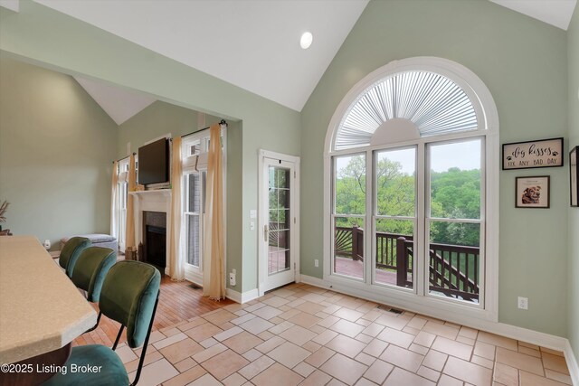 302 Hampton Rd, Brandenburg, KY 40108 - doorway to outside with high vaulted ceiling, visible vents, baseboards, and a fireplace