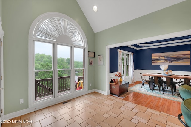 302 Hampton Rd, Brandenburg, KY 40108 - dining area featuring a healthy amount of sunlight, high vaulted ceiling, wainscoting, and visible vents