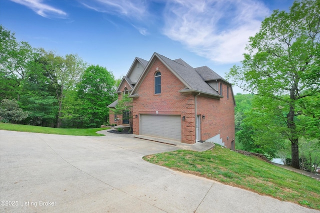 302 Hampton Rd, Brandenburg, KY 40108 - view of property exterior with brick siding, a garage, a yard, and concrete driveway