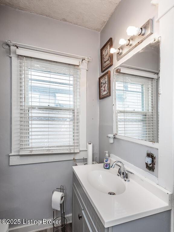 656 S 39th St, Louisville, KY 40211 - bathroom featuring a textured ceiling and vanity