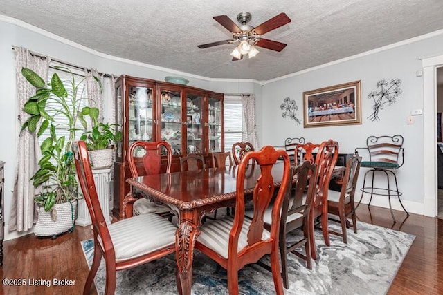 656 S 39th St, Louisville, KY 40211 - dining area with ceiling fan, ornamental molding, a textured ceiling, and wood finished floors