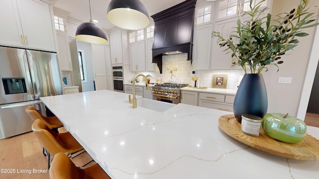 2045 W Rhudes Creek Rd, Elizabethtown, KY 42701 - kitchen featuring glass insert cabinets, premium range hood, a sink, appliances with stainless steel finishes, and backsplash