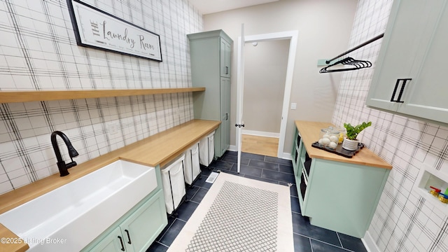 2045 W Rhudes Creek Rd, Elizabethtown, KY 42701 - mudroom featuring a sink and dark tile patterned floors