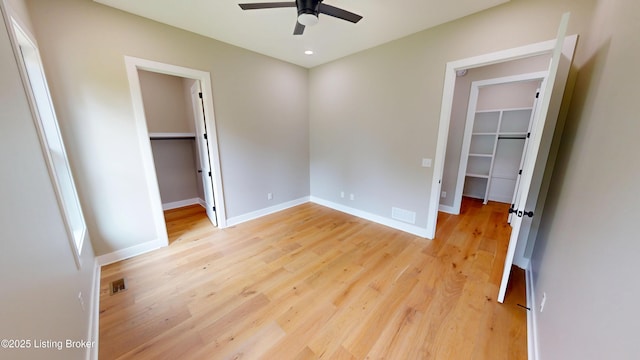 2045 W Rhudes Creek Rd, Elizabethtown, KY 42701 - unfurnished bedroom with baseboards, a closet, light wood finished floors, a spacious closet, and recessed lighting