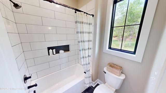 2045 W Rhudes Creek Rd, Elizabethtown, KY 42701 - bathroom with shower / bath combo with shower curtain, baseboards, and toilet