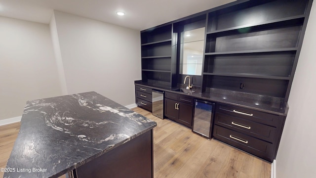 2045 W Rhudes Creek Rd, Elizabethtown, KY 42701 - bar featuring wine cooler, baseboards, light wood-style floors, and a sink