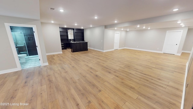 2045 W Rhudes Creek Rd, Elizabethtown, KY 42701 - unfurnished living room featuring recessed lighting, light wood-style flooring, and baseboards