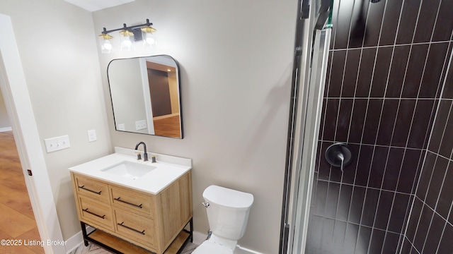 2045 W Rhudes Creek Rd, Elizabethtown, KY 42701 - full bathroom with vanity, baseboards, toilet, and tiled shower