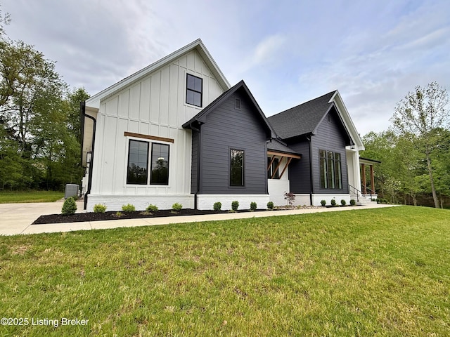2045 W Rhudes Creek Rd, Elizabethtown, KY 42701 - modern farmhouse style home with board and batten siding, central AC unit, and a front yard